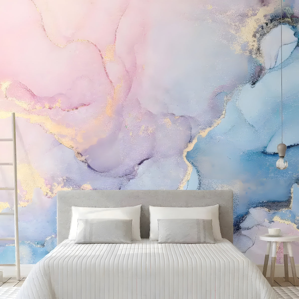 Pink, blue and gold alcohol ink marble mural behind a gray bed in bedroom