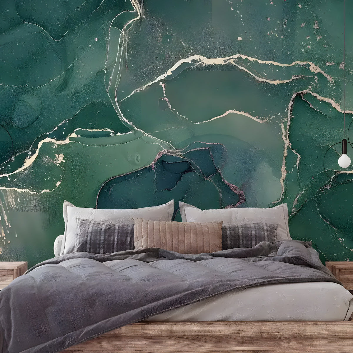 Emerald green and gold ink marble mural behind a wood bed with gray bedding