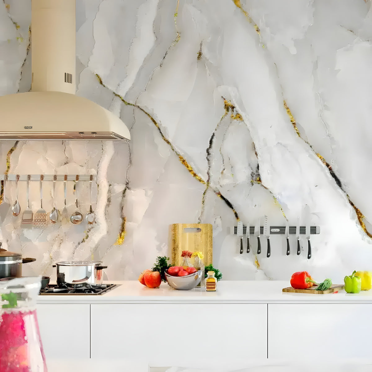 White and gold-veined marble ink mural as kitchen backsplash behind range hood