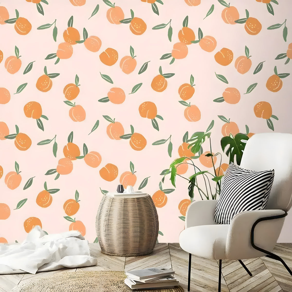 Peach fruit wallpaper on blush pink behind a white accent chair and rattan side table