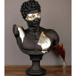 Matte black Hermes bust with gold leaf across the eyes and gilded chest patches