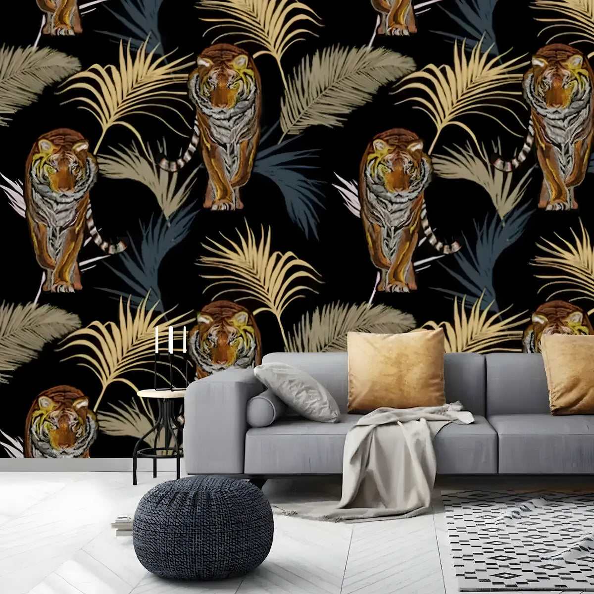 Tigers and palm leaves wallpaper on black background behind a grey sofa with gold pillows