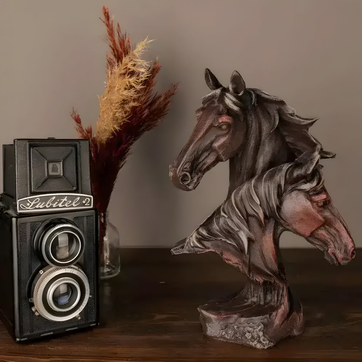 Bronze double horse-head bust with flowing manes in reddish-brown finish on textured base