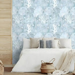 Abstract coastal cottage wallpaper featuring sea creatures and coral designs in soft blue and white tones, ideal for beach-themed interiors.
