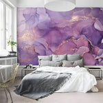 Abstract purple and gold marble wallpaper featuring fluid designs and elegant patterns, perfect for enhancing interior decor.