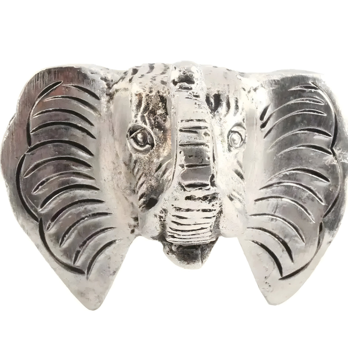 Close-up of a single silver elephant head cabinet knob with detailed ears, trunk and tusks on white