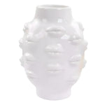 White glossy ceramic vase covered in raised lip reliefs all around its rounded body with a narrow neck opening