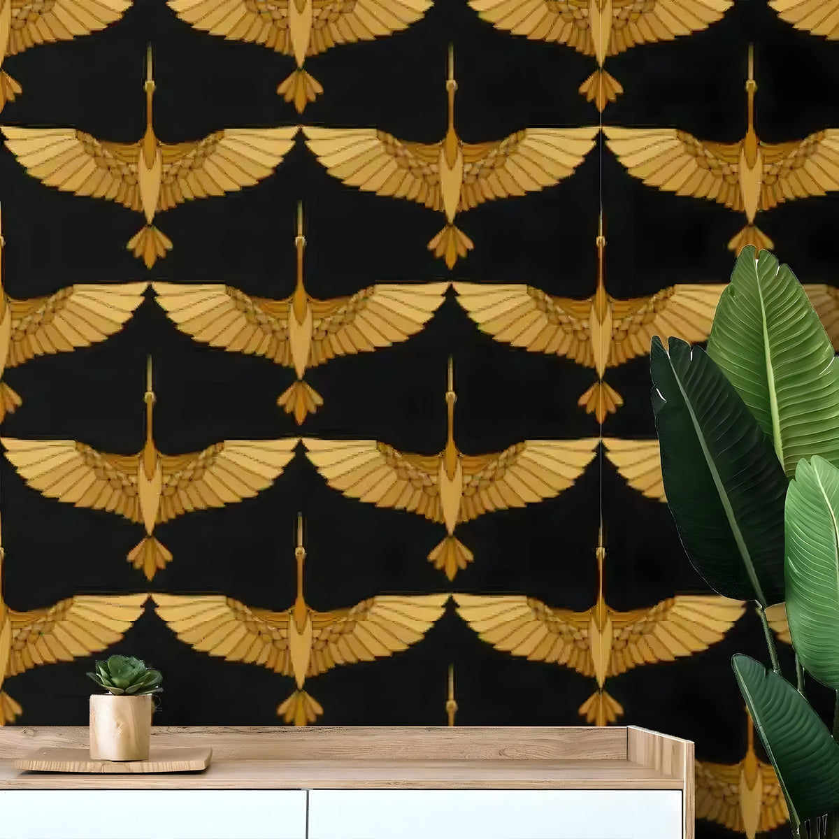 Close-up of art deco gold crane wallpaper — symmetrical gold flying cranes on black, over wood sideboard