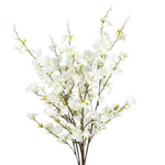 Four faux cherry blossom stems clustered together showing abundant white blooms and green buds on dark bare branches