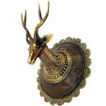 Antique gold brass carved deer head knob on ornate circular scrolled backplate, side view, white background