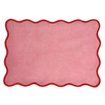 Single pink cotton scallop placemat with handmade red wavy border — blush pink rectangular placemat, flat view