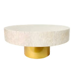 Round mother of pearl coffee table with white iridescent mosaic top and cylindrical gold pedestal base