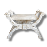 White mother of pearl floral inlay X-frame ottoman, cream cushioned seat, gray background