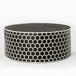Black honeycomb bone inlay round coffee table — low drum form covered in black and white hexagons