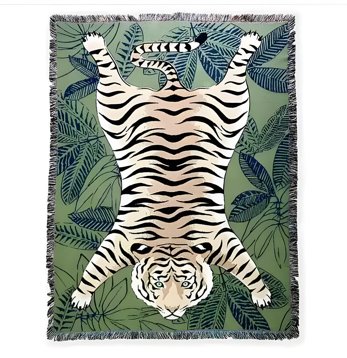 Tiger lying in green wild printed throw, flat lay — orange tiger on tropical leaf print, fringe