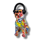 Bulldog pop sculpture with vibrant multicolor graffiti paint and black headphones, seated front view, white bg