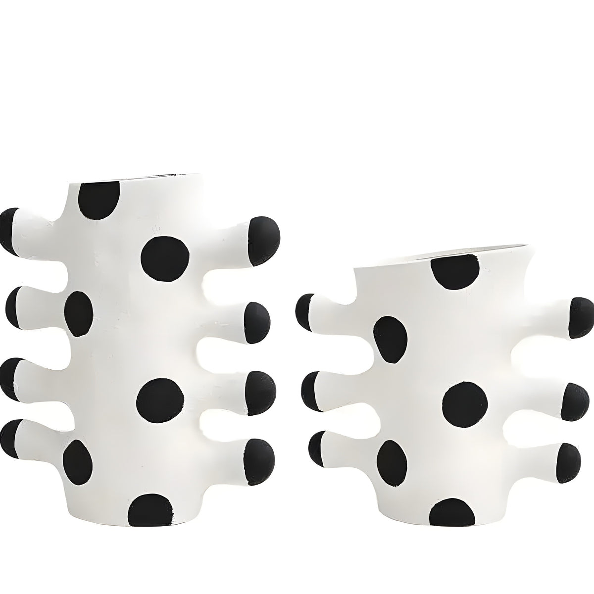 Two tribal wave ceramic vases, white with black polka dot pattern and finger-like protrusions, front view