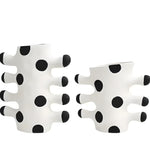 Two tribal wave ceramic vases, white with black polka dot pattern and finger-like protrusions, front view