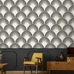 Art Deco oversized fans wallpaper in black and white, living room with mustard armchair and wood sideboard