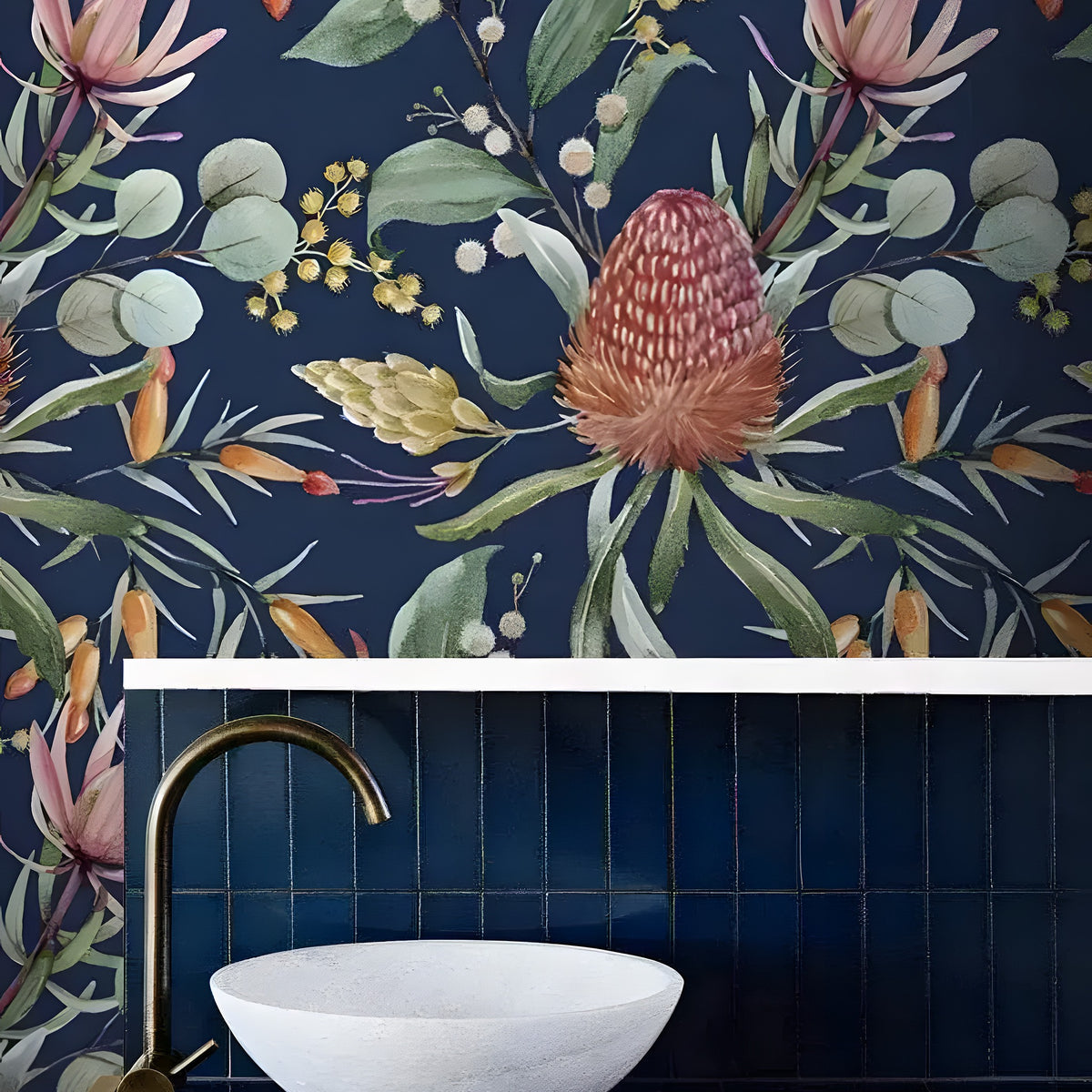 Exotic Flowers and Leaves watercolor wallpaper on dark navy in bathroom with marble vessel sink, gold tap