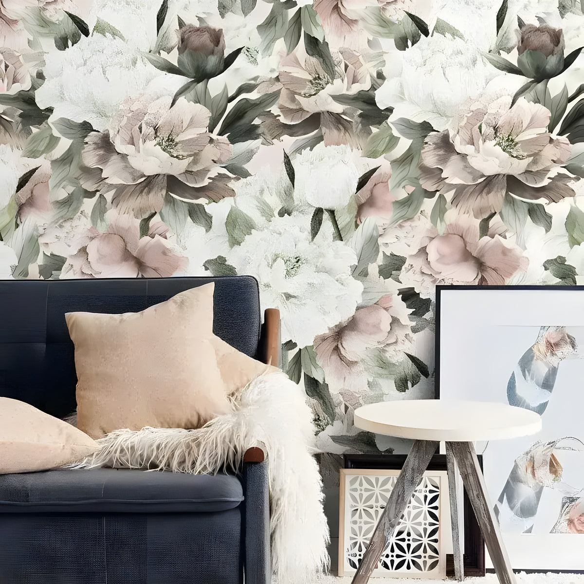Vintage oversized peonies wallpaper with blush pink and white blooms and sage leaves, behind charcoal sofa in boho living room