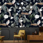 White Flowers and Peacocks dark wallpaper as upper mural, mustard armchair, teak sideboard below
