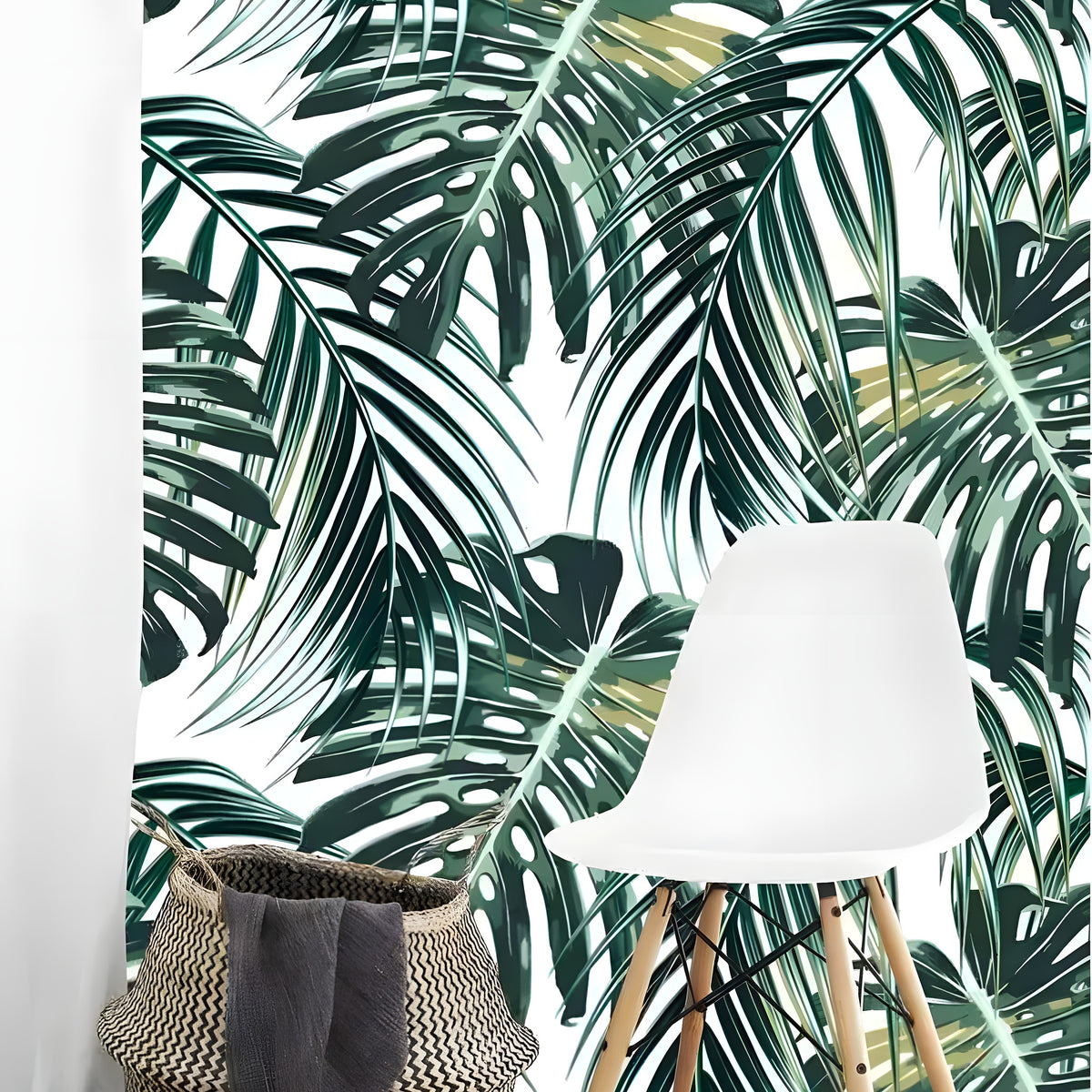 Tropical oversized monstera and palm leaves wallpaper on white in bright nook with white chair and woven basket