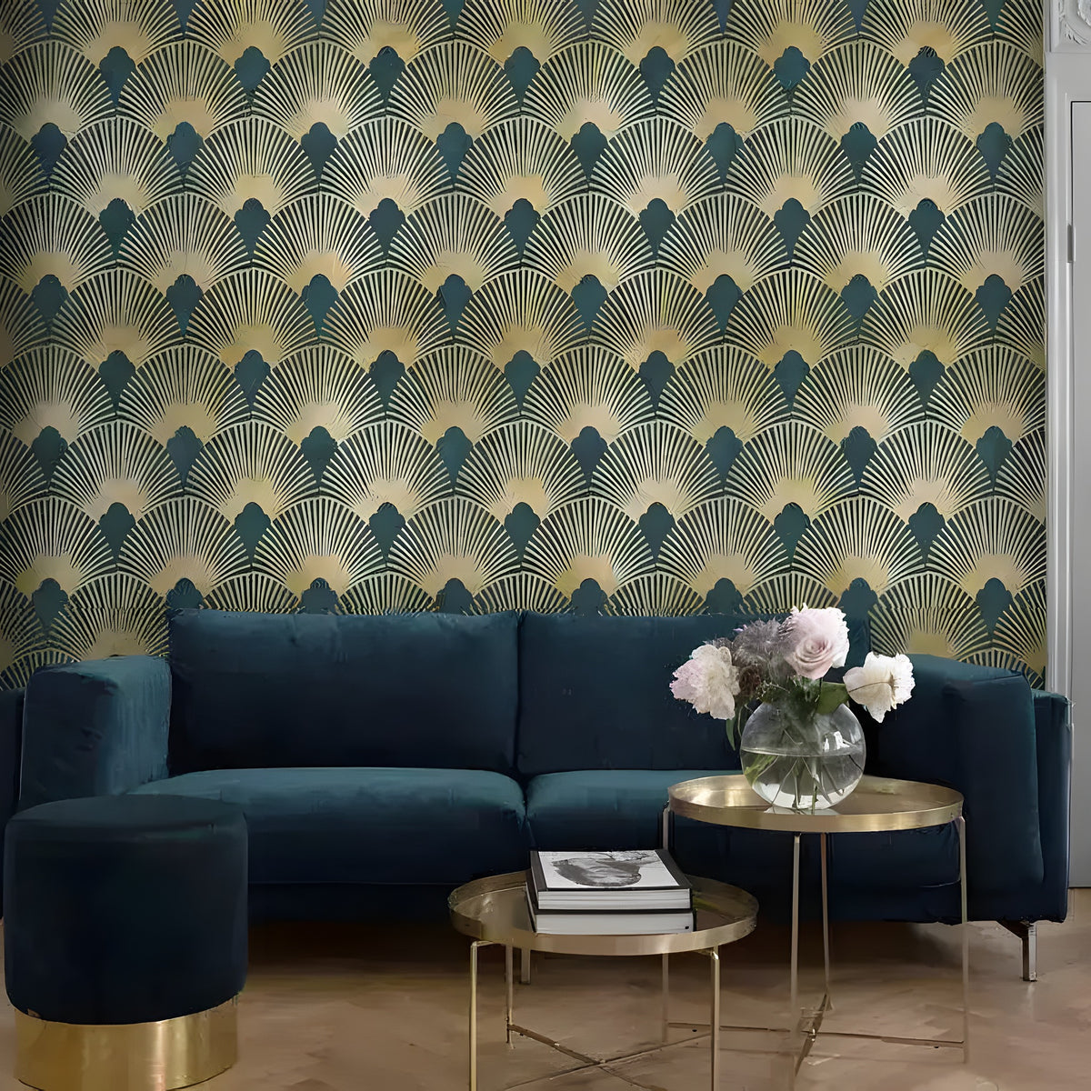 Vintage gold art deco fans wallpaper in a living room with teal velvet sofa and gold tables