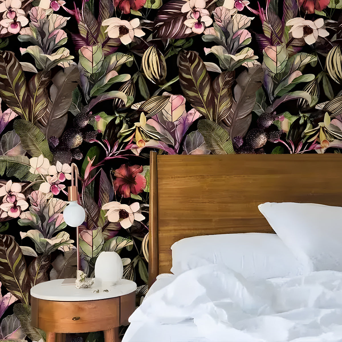Dark tropical floral wallpaper with white orchids and lush leaves behind wood headboard and white bedding