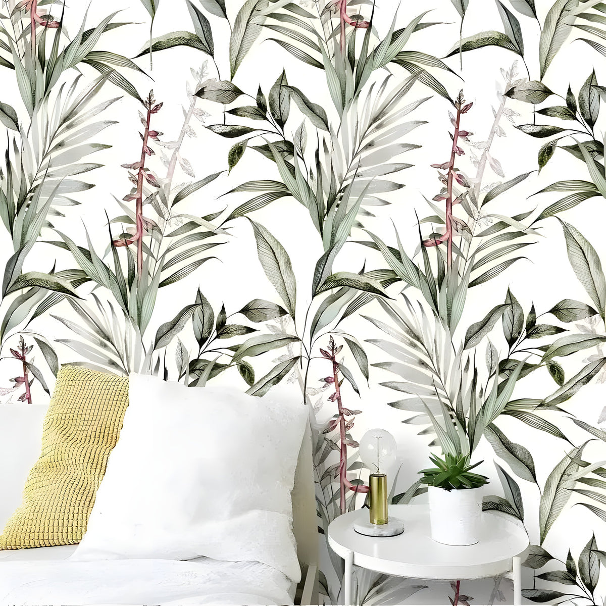 Birds of paradise botanical wallpaper in a bedroom with white linen and yellow knit cushion