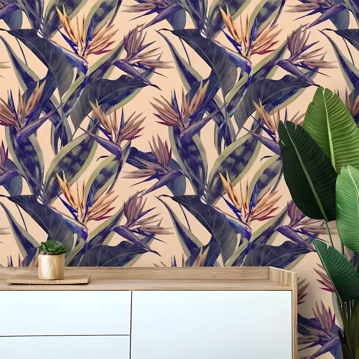 Tropical paradise floral with bird-of-paradise blooms and blue banana leaves on cream; wood sideboard with plant
