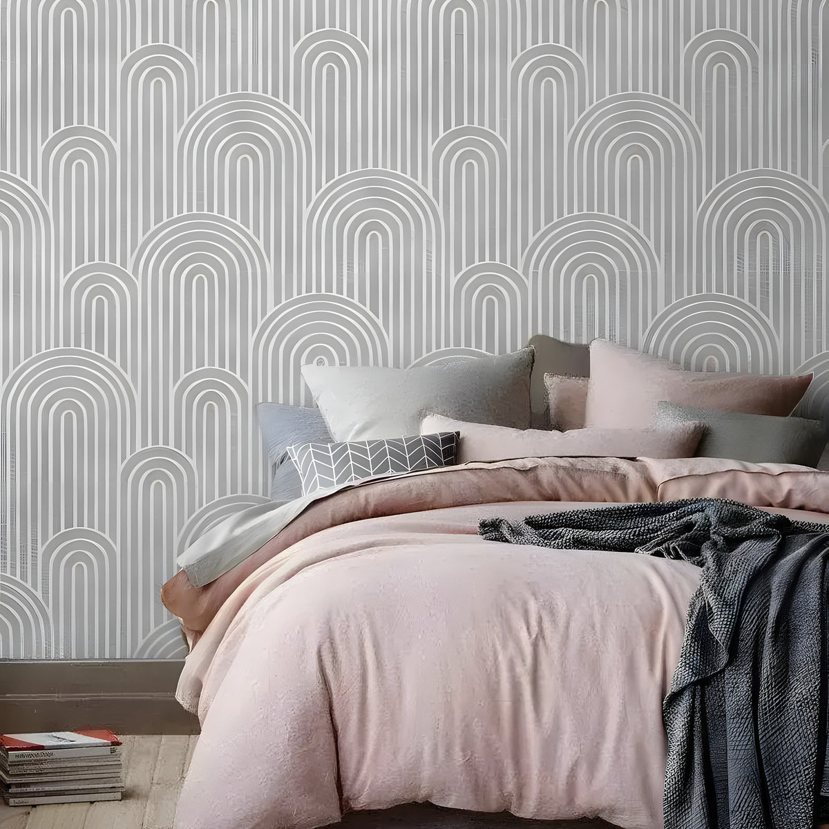 Bed with blush pink duvet and grey throw; faux silver gray art deco arch column wallpaper with repeating silver arch motifs