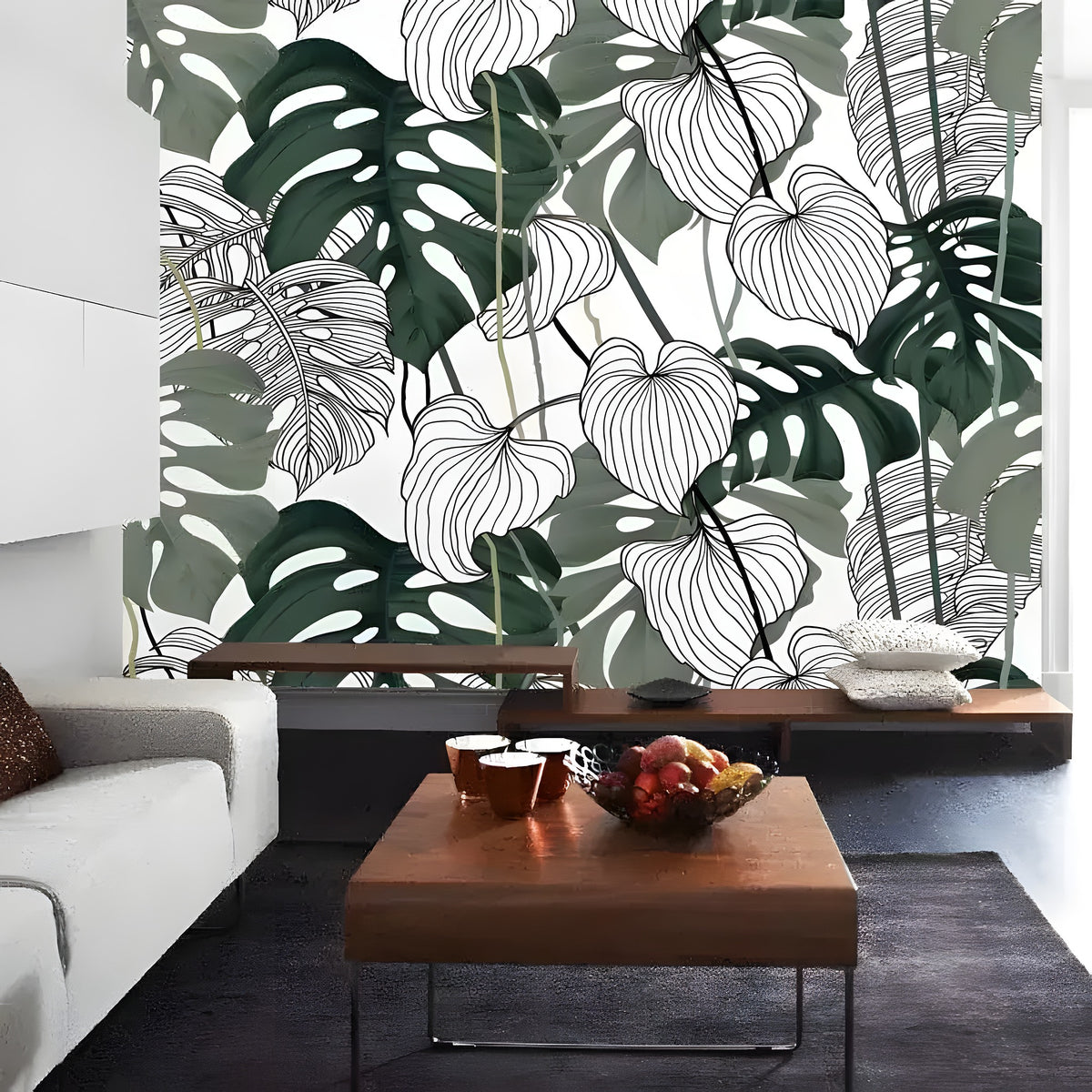 Tropical monstera leaf mural in a modern living room — dark green filled and white line-art leaves on white