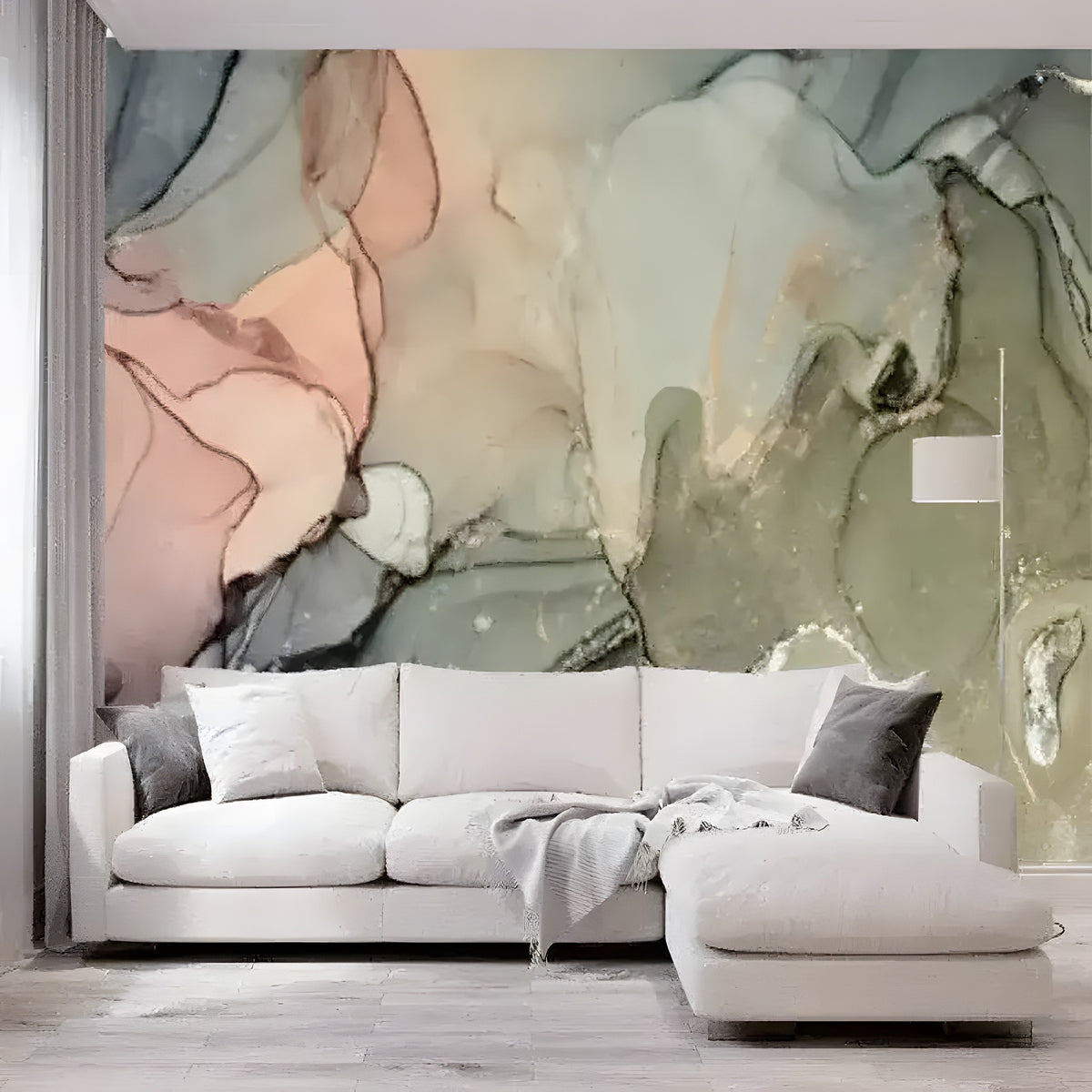 Pastel pink, sage and blue-gray fluid marble mural as accent wall behind white sectional sofa with cushion throw