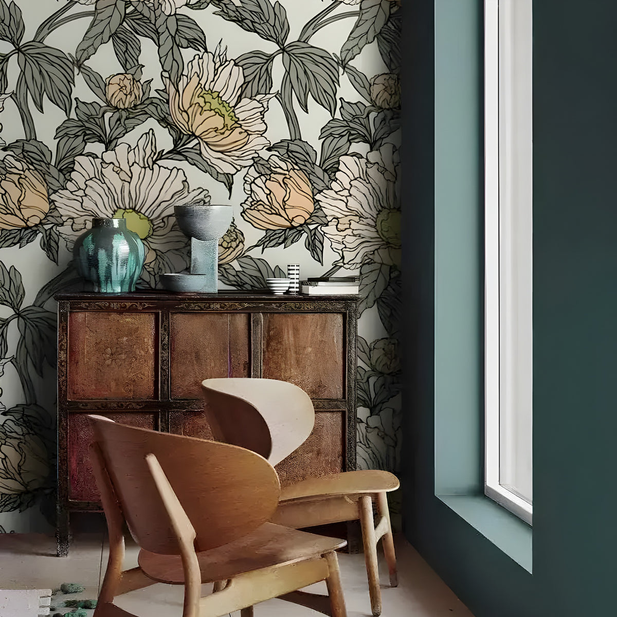 Dramatic oversized floral wallpaper in styled room with rich botanical motif and statement furniture