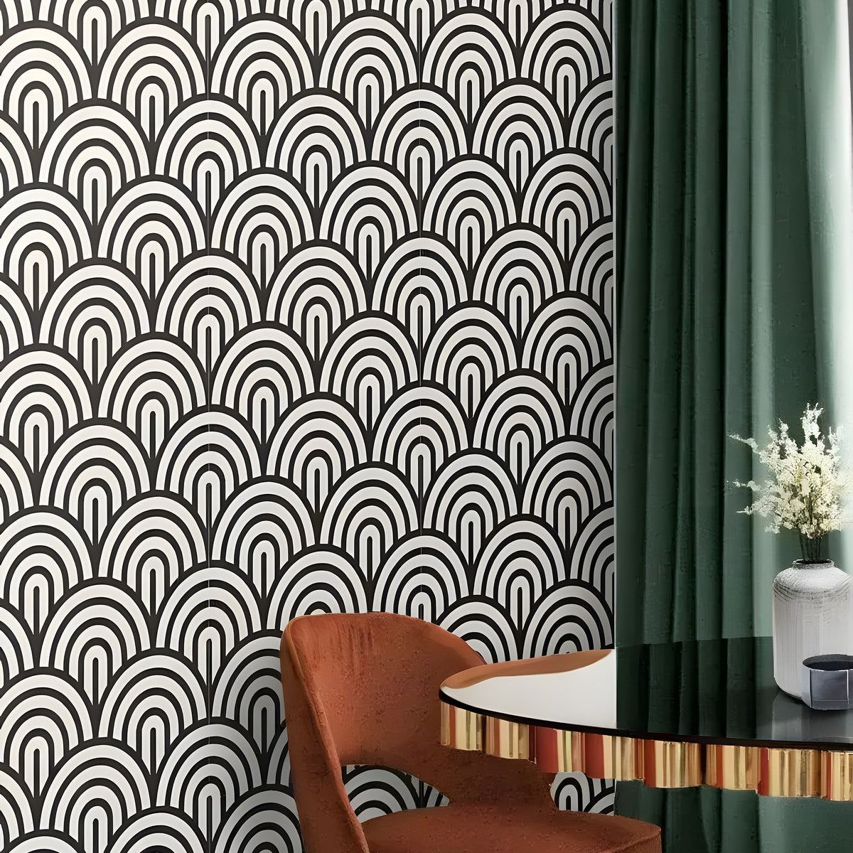 Black and white fish scale wallpaper in room with rust velvet chair and dark green curtain