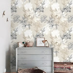 Gray and white floral peony wallpaper in a nursery with a gray dresser, wicker baskets, and bird wall ornaments