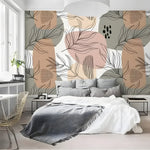 Neutral abstract boho wallpaper with terracotta and sage shapes in Scandi bedroom with grey bedding
