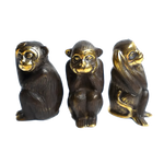 Three dark brass monkey statues set of 3, seated side by side, gold-accented faces, light gray background
