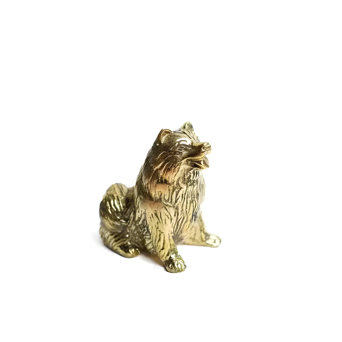 Polished gold brass fluffy dog sculpture seated with head raised, 3/4 front angle
