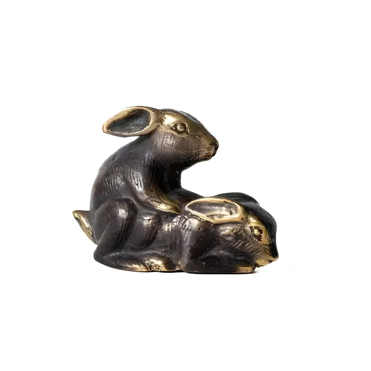 Pair of brass making-love rabbits figurine in black polish, one atop the other, side view on white