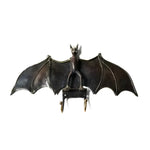 Bat wall hook with wings spread wide, dark black finish, two gold-tipped hooks below body, front view