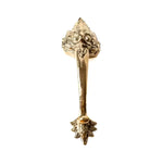 Polished brass Barong door handle with ornate face, elongated bar, and decorative floral base