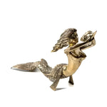 Solid brass mermaid statue reclining with flowing hair and fish-scale tail, raising a conch shell overhead