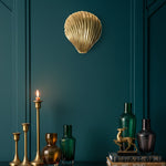 Solid Brass Clam Shell Shaped Wall Hanging Hook styled in a room setting