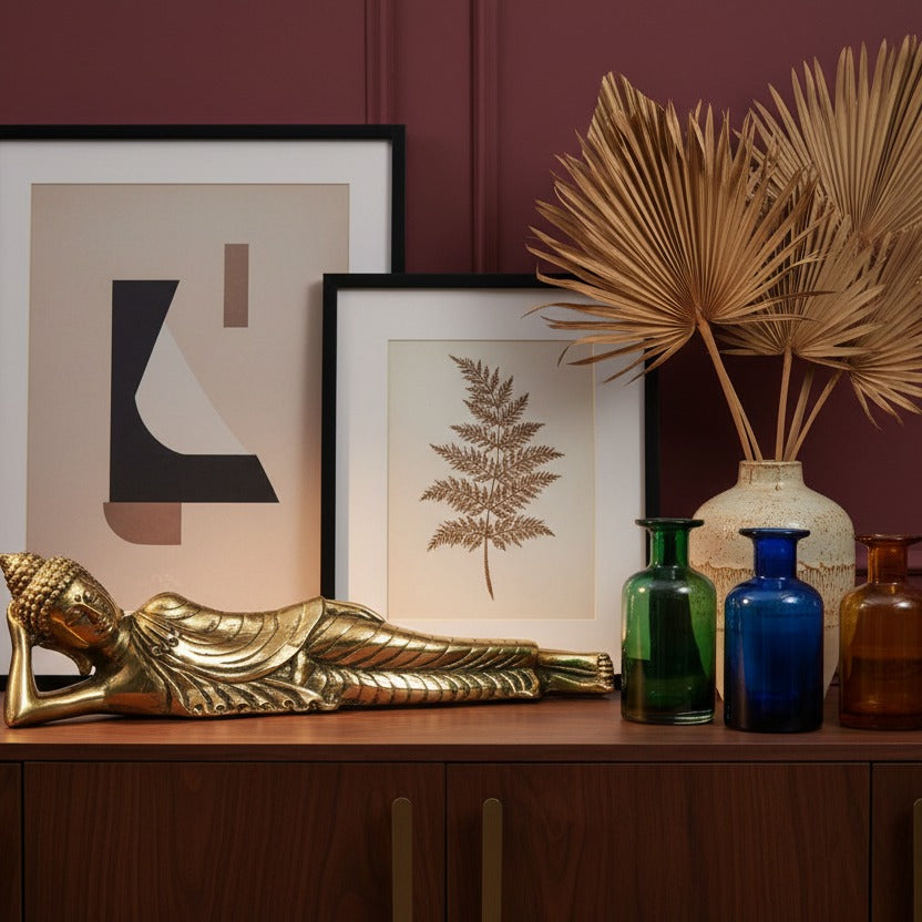 Bronze Reclining Buddha Figurine styled in a room setting