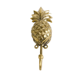 Single polished gold brass pineapple wall hook, front view on grey background, textured fruit body and leafy crown