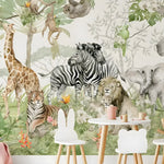 Safari jungle wallpaper mural with giraffe, zebras, tiger and elephant in a child's playroom with animal chairs