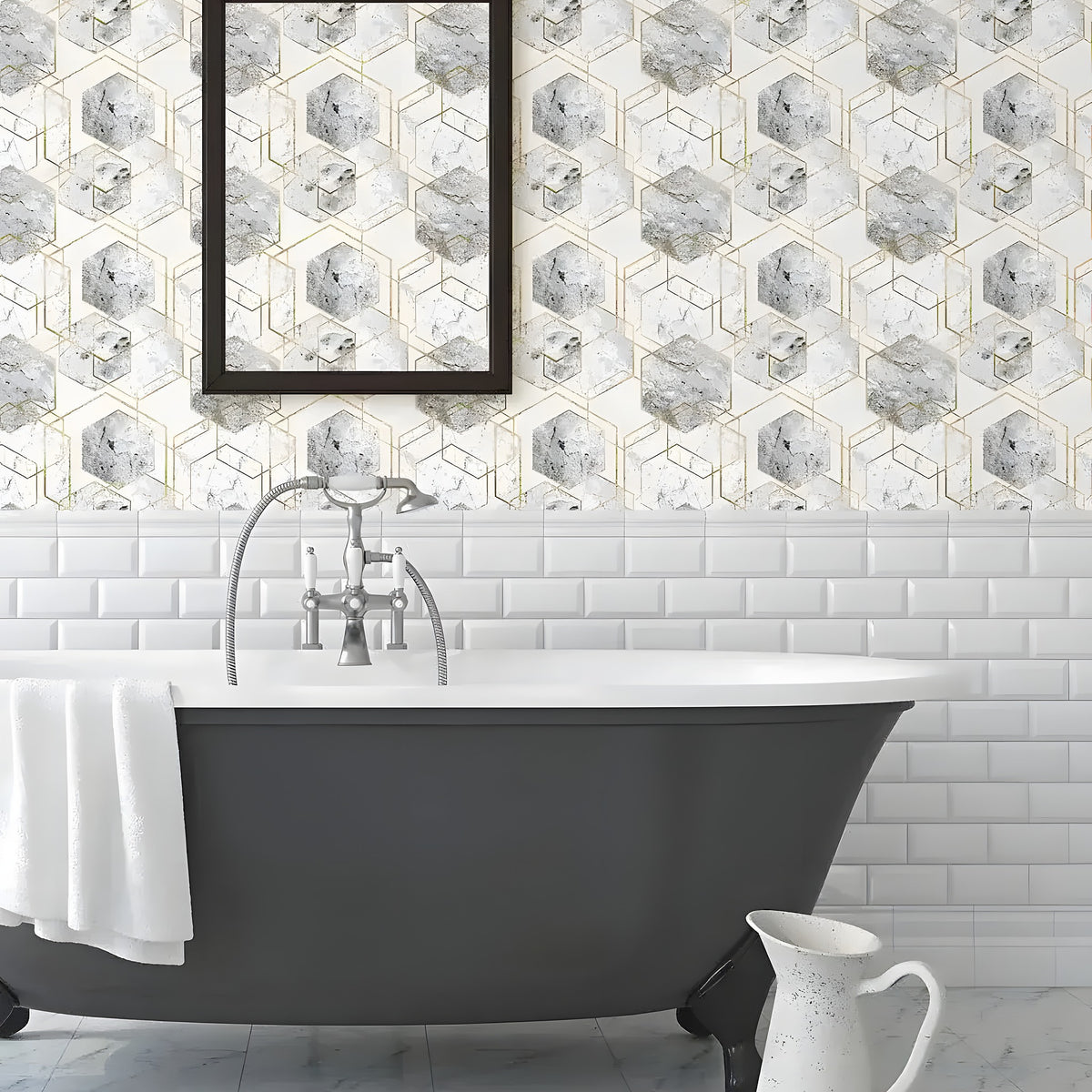 Honeycomb marble gold hexagon wallpaper in a bathroom above subway tiles with dark clawfoot tub and mirror