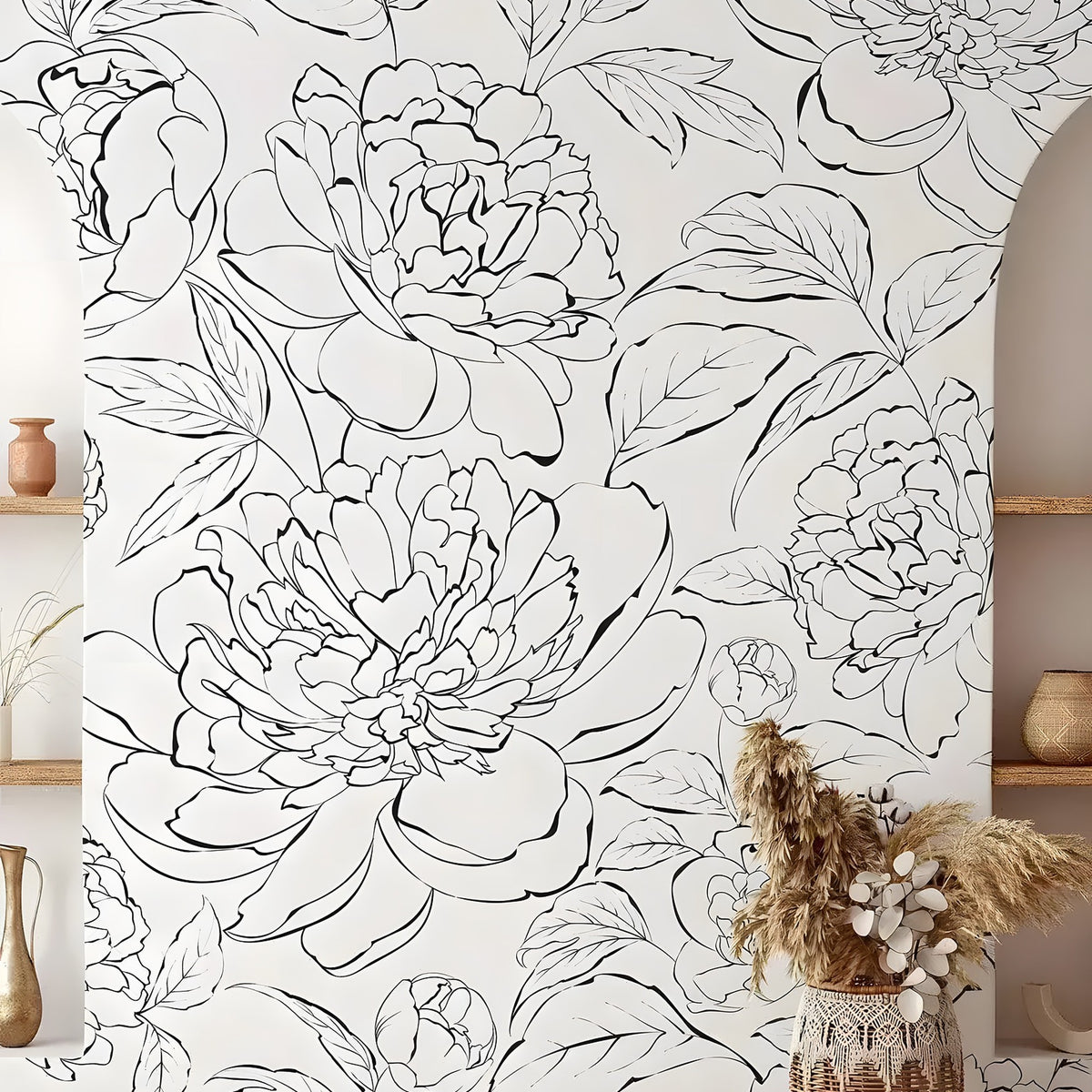 Black and White Line Art Peony mural in boho room with large ink peony blooms, pampas grass in wicker vase, and wood shelves